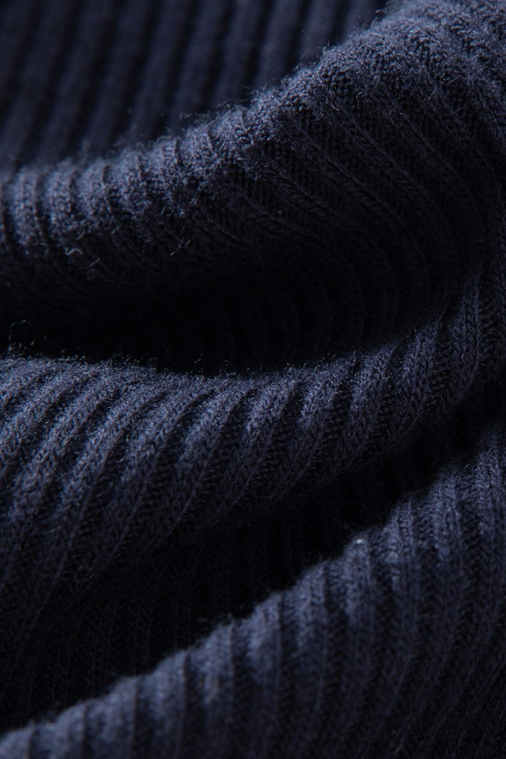 Close-up of ribbed navy blue fabric texture