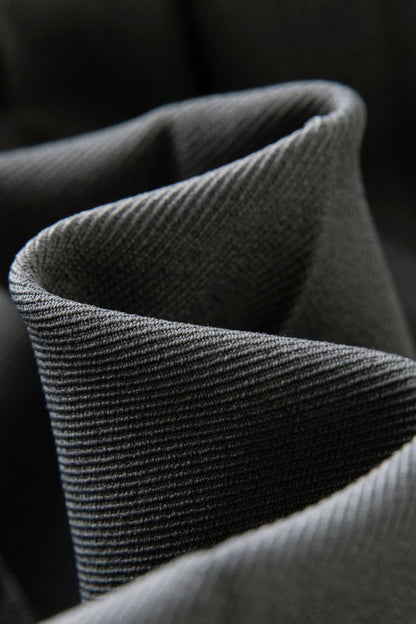 Close-up of fabric texture showing pleated material