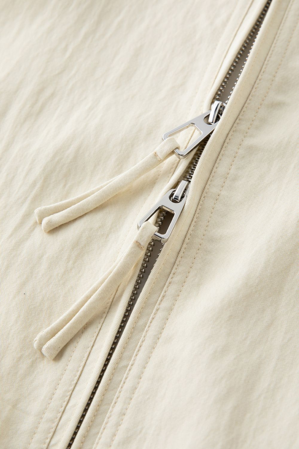 Close-up of cream skirt zipper detail