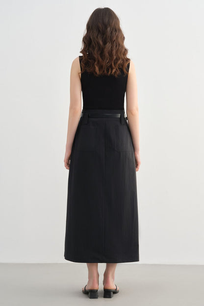 Back view of black midi skirt styled with a sleeveless top