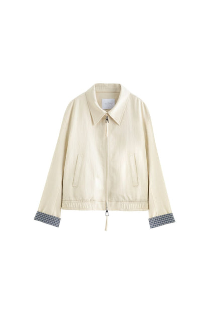 Flat lay of cream jacket with inner lining