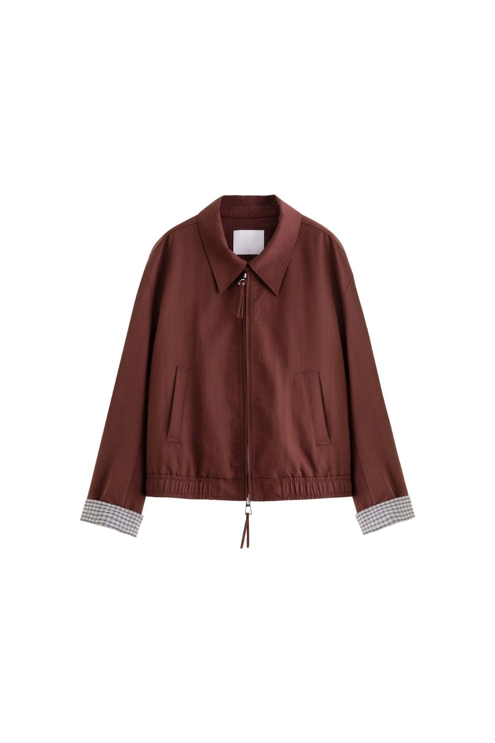 Flat lay of brown jacket with check inner lining