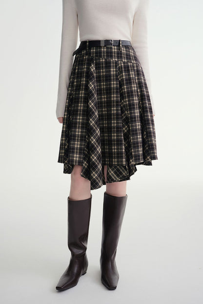 Front view of plaid flared skirt paired with a tucked-in sweater