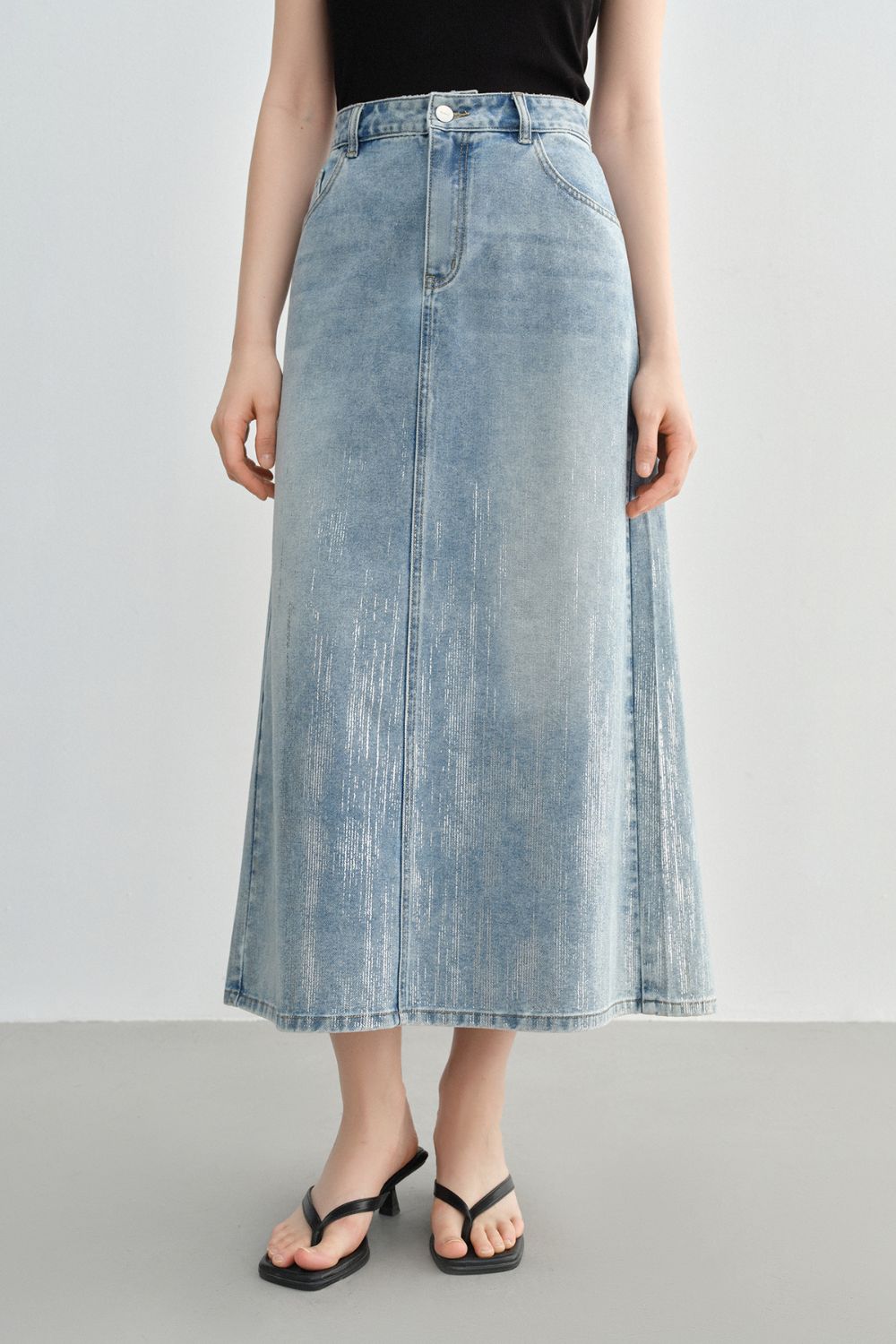 Front view of light blue denim skirt showing straight fit and length