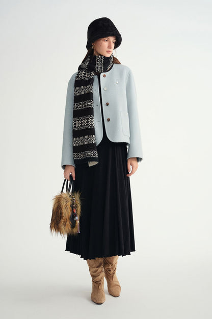 Full front view of model in black ribbed midi dress