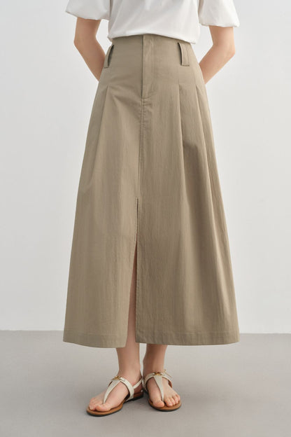 Full front view of beige midi skirt styled with a white blouse