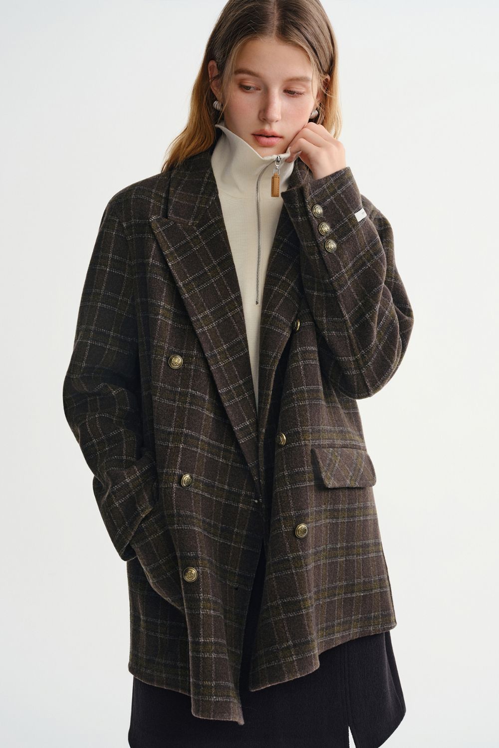 Side view of plaid double-breasted coat with lapel collar