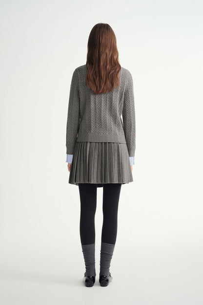 Back view of gray sweater and pleated skirt outfit