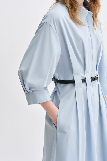Side view of light blue belted dress with relaxed silhouette