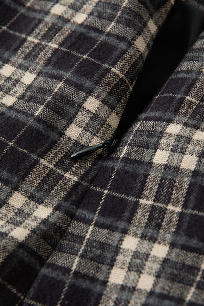 Close-up of plaid fabric texture in black and beige tones