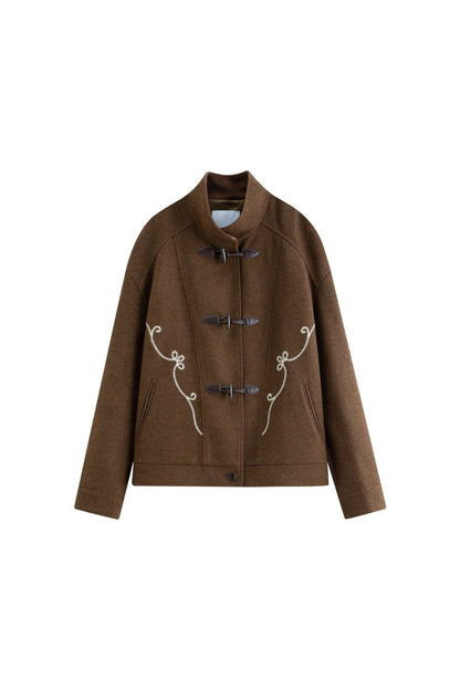 Flat lay of brown toggle jacket with toggle closures