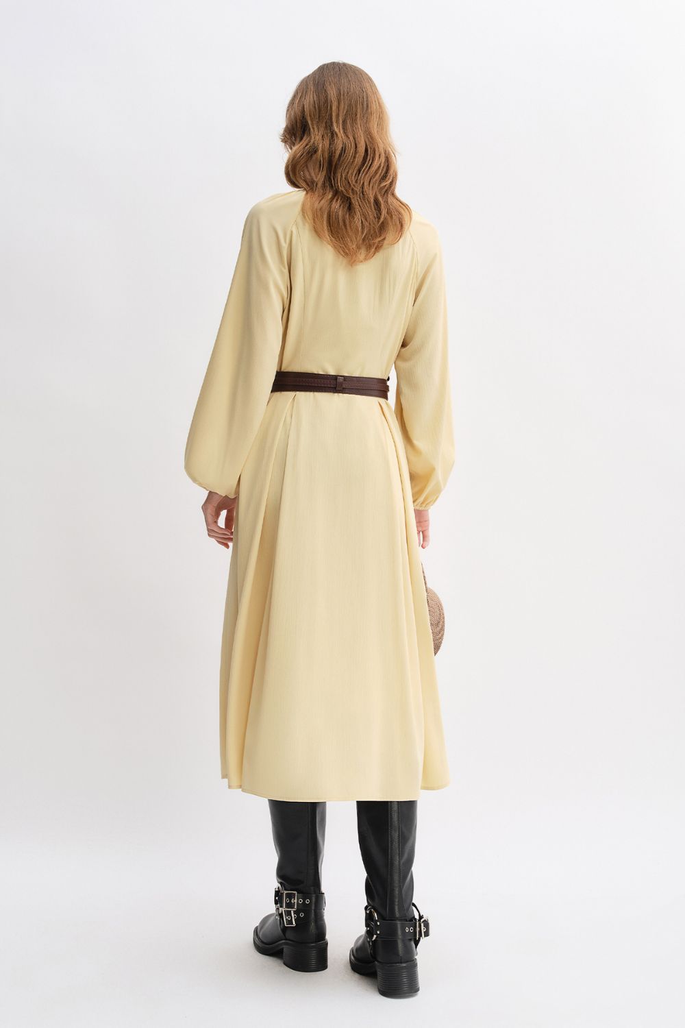 Back view of yellow long-sleeve belted dress