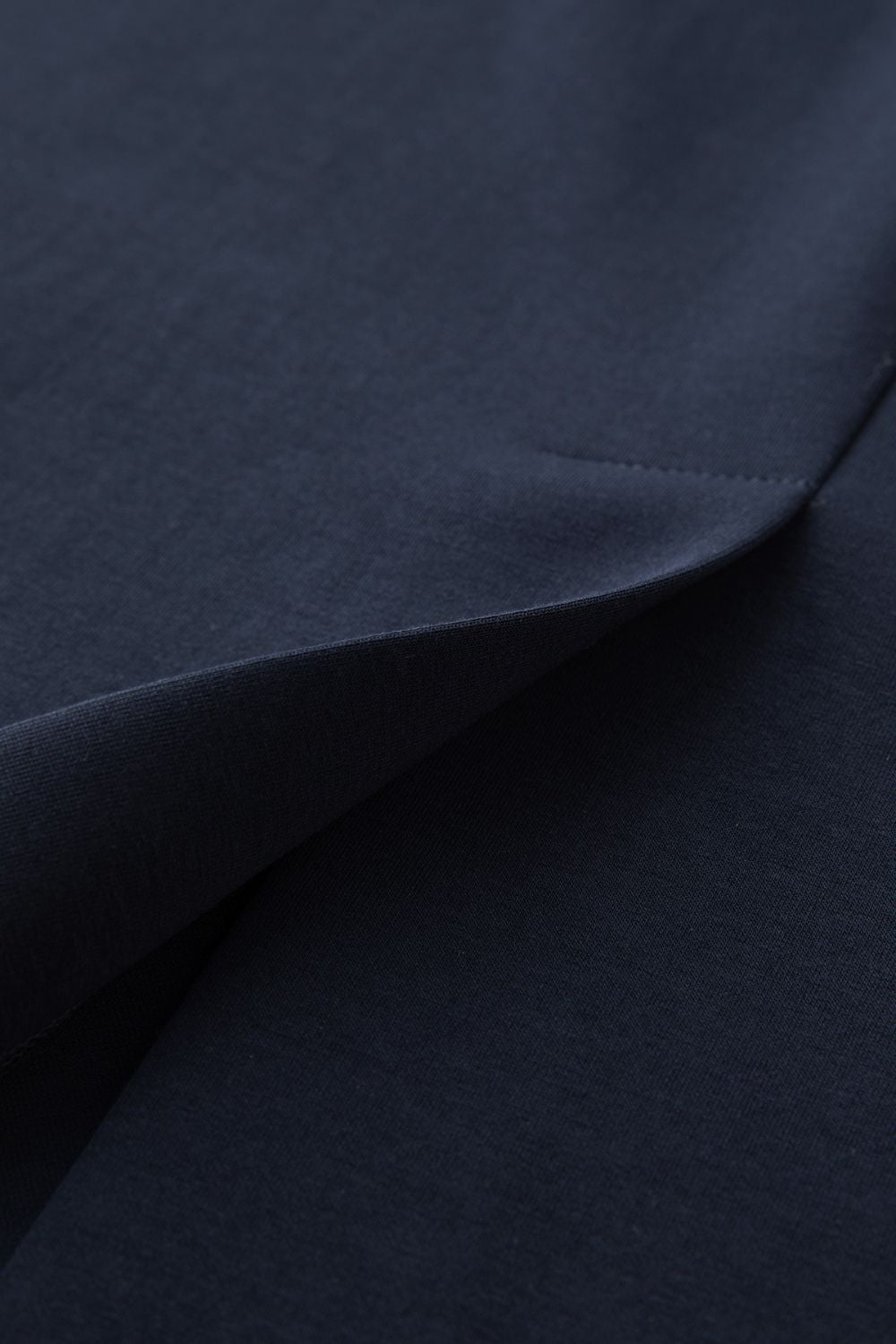 Close-up of navy blue skirt fabric texture