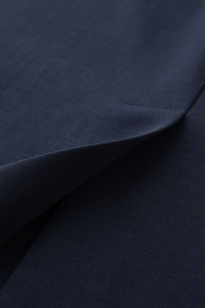 Close-up of navy blue skirt fabric texture