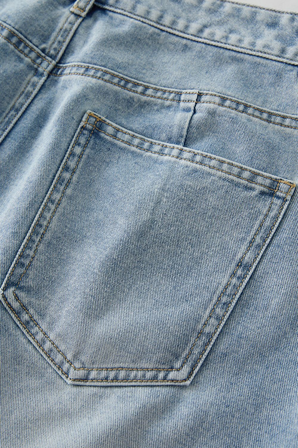 Rear view of light blue denim skirt with back pockets