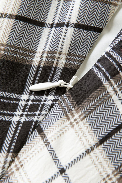 Detailed view of plaid fabric texture and stitching