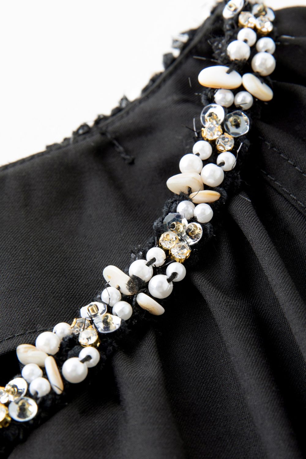 Detail shot of beaded embellishment around neckline