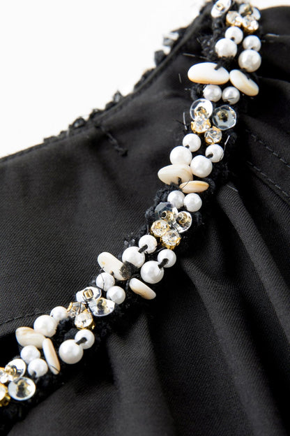 Detail shot of beaded embellishment around neckline