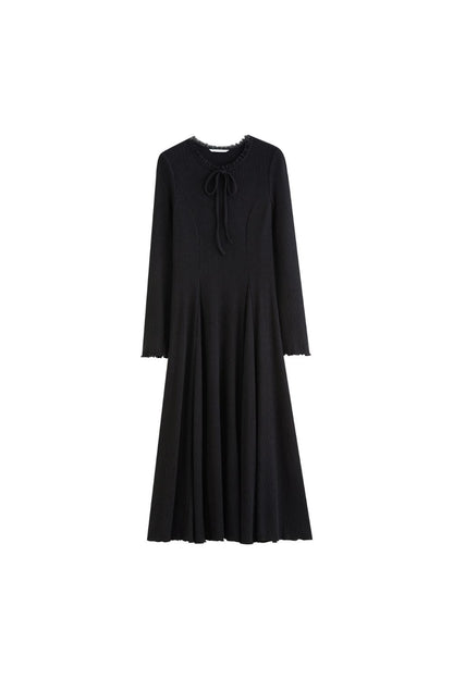 Flat lay of black ribbed midi dress