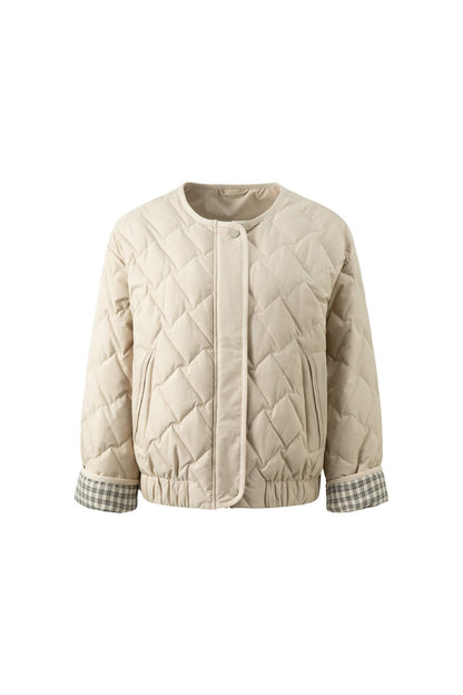 Flat lay of beige quilted jacket
