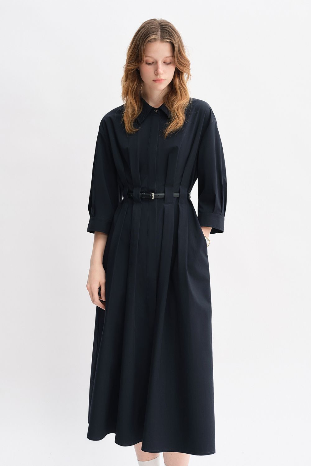 Front view of black belted midi dress with long sleeves