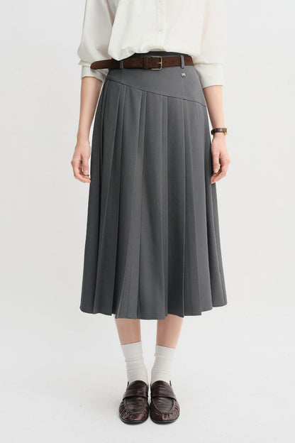 Front view of gray pleated midi skirt styled with a belt